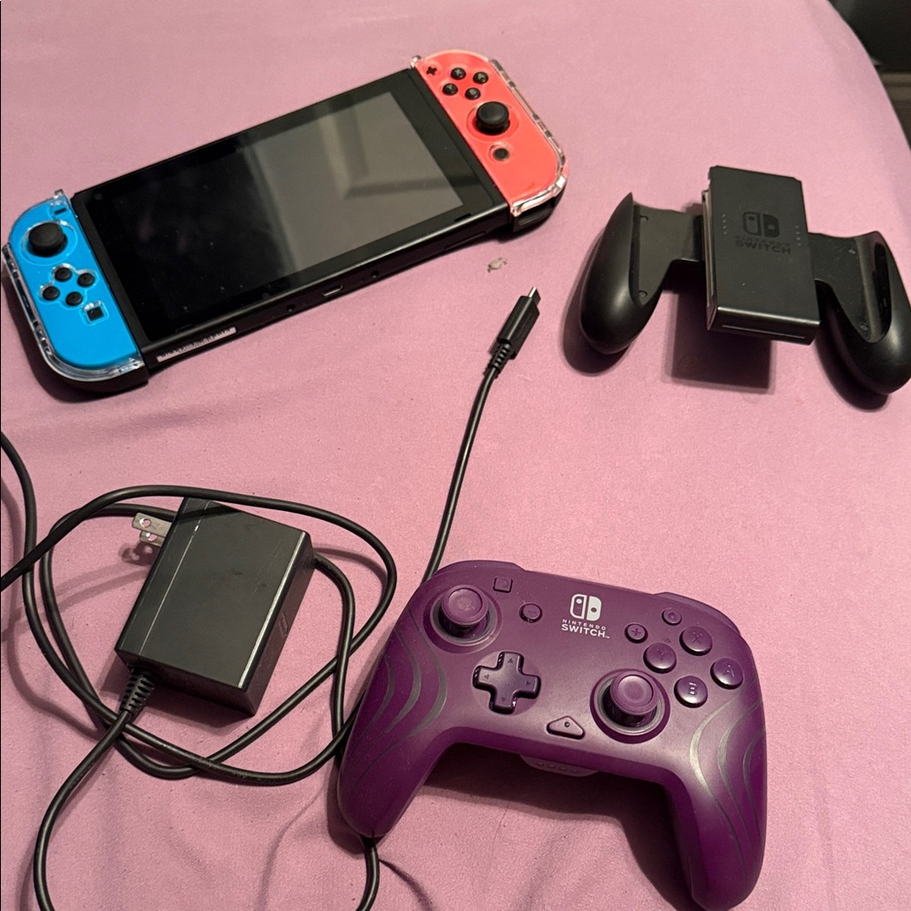 Nintendo Switch with Red, Blue Joy-Con and Purple Controller